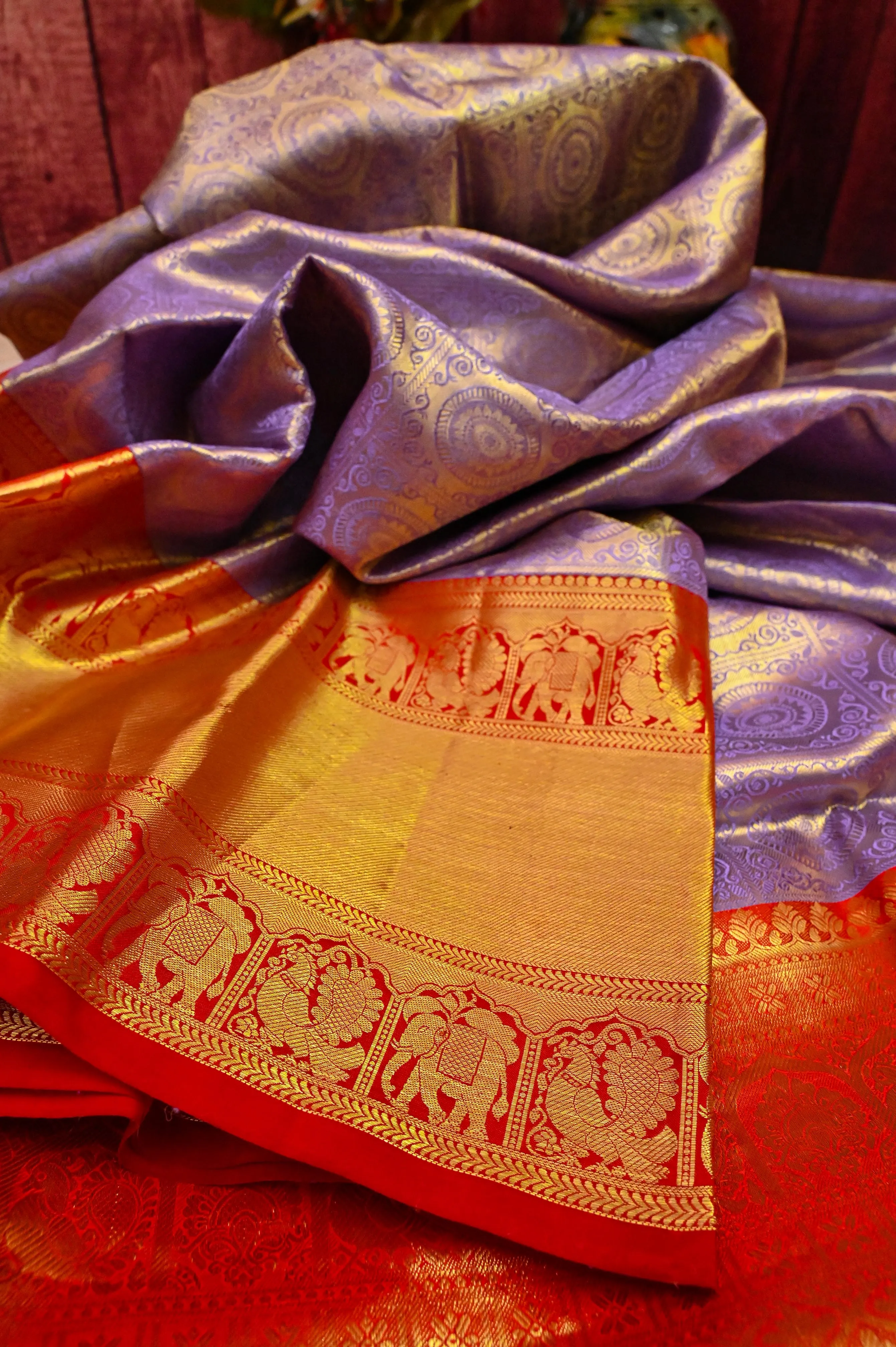 Deep Lavender Color Pure Brocade Kanjeevaram with Broad Golden Zari Border